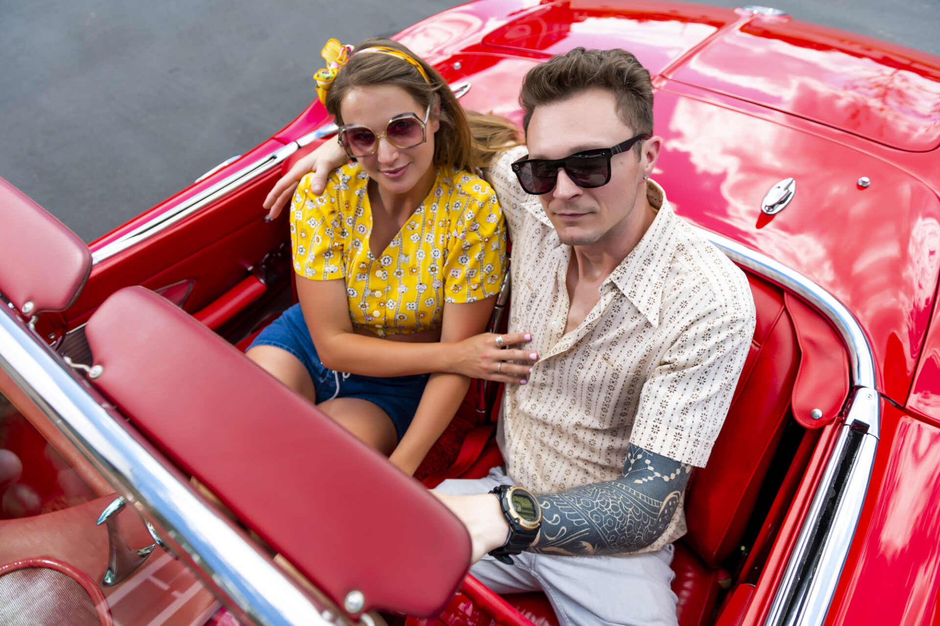 evolve staycation blog people in red convertible