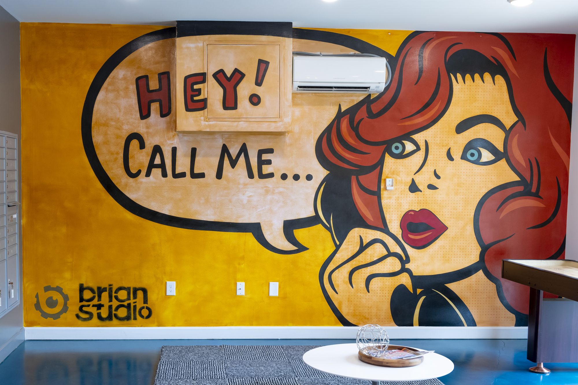 mural that reads "hey! call me..."