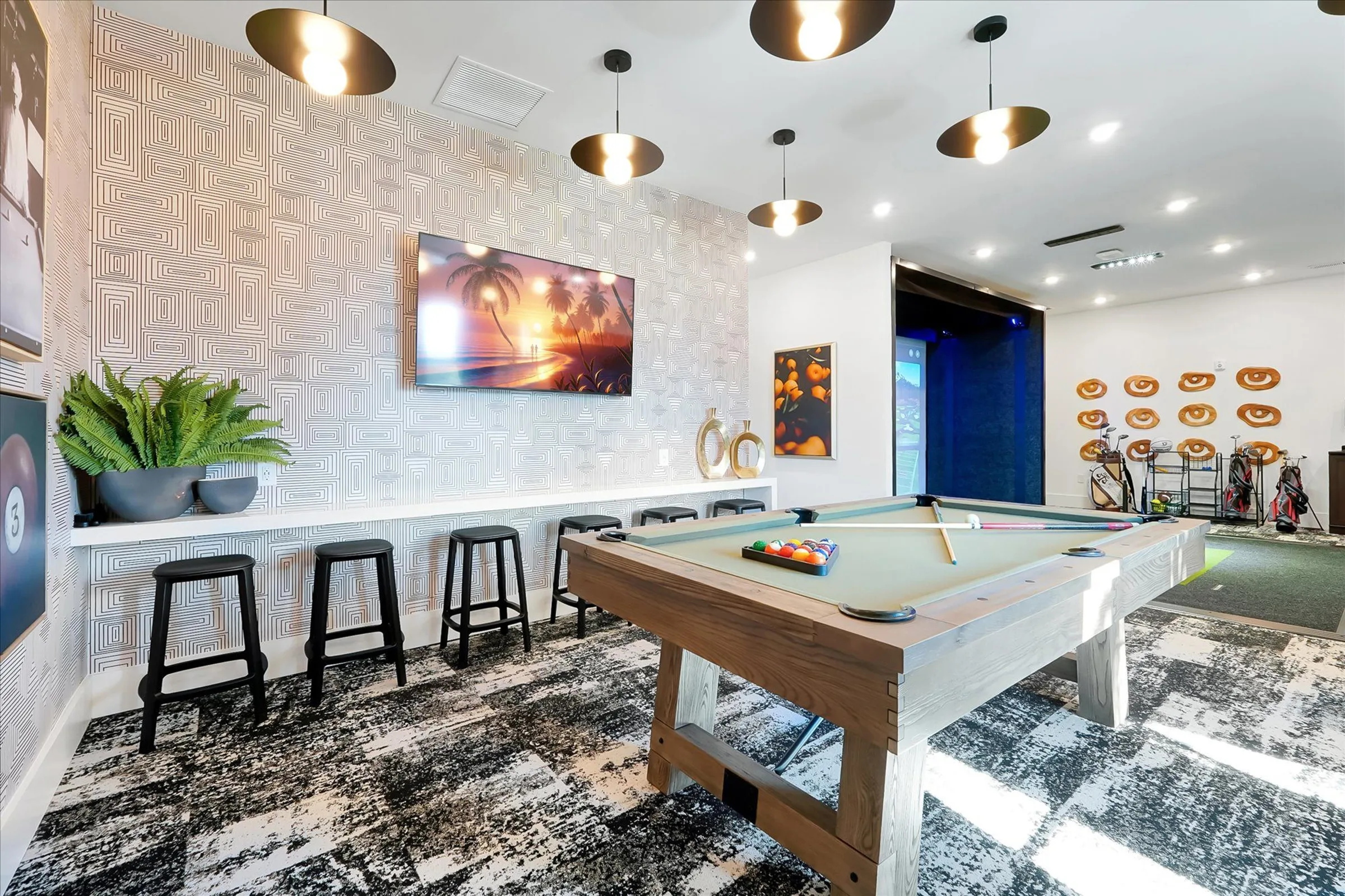 billiards table and golf simulator in evolve grove park game room